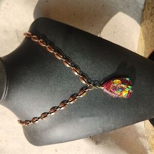Pendant necklace in copper tones